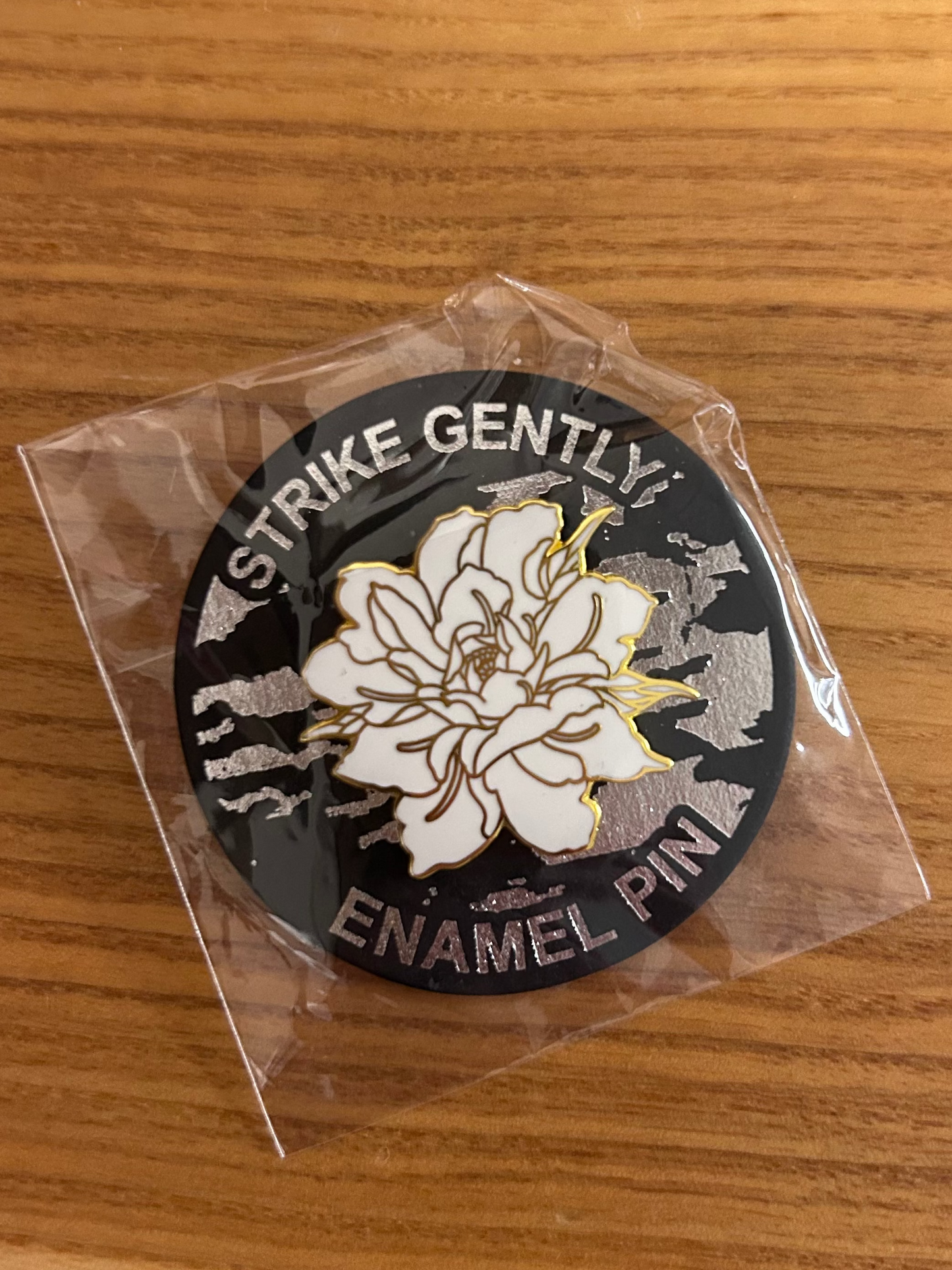 White and gold flower pin