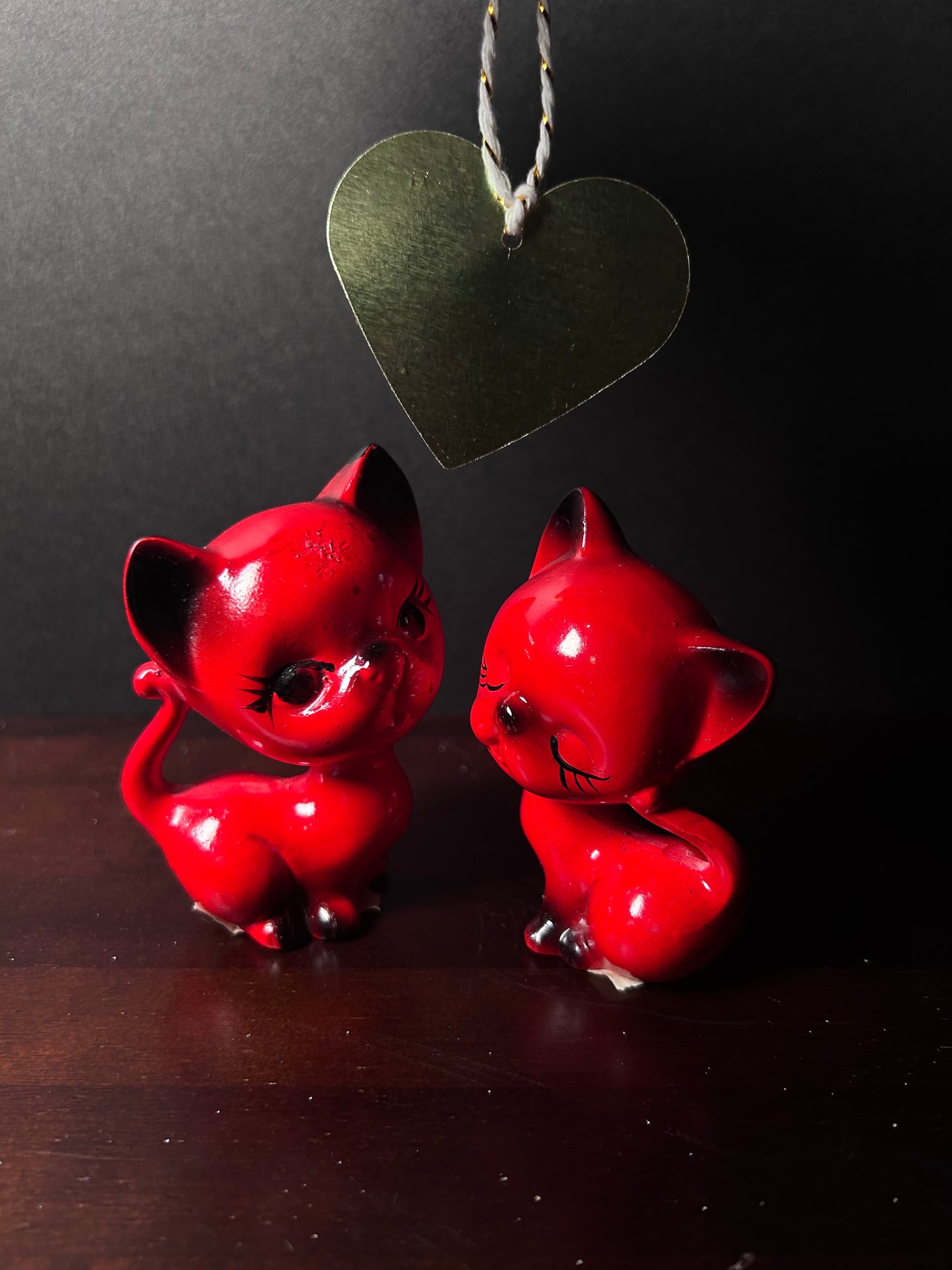 Red cat figurines