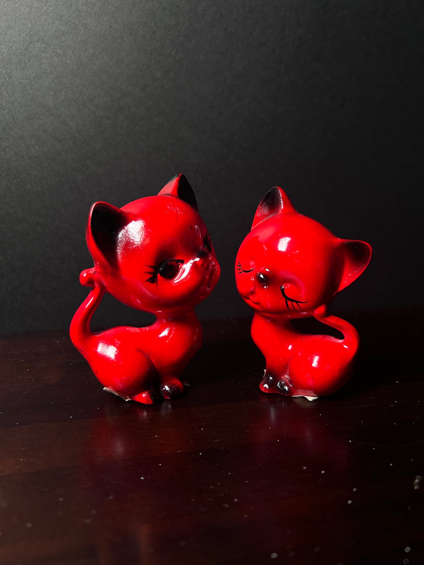 Red cat figurines