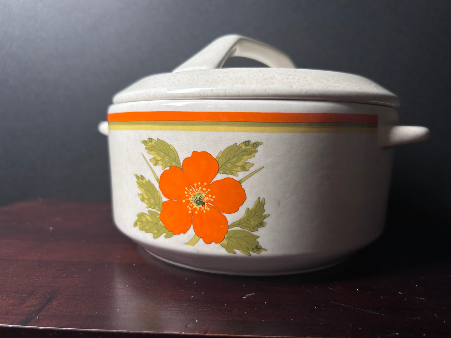 Orange temperware serving bowl with lid