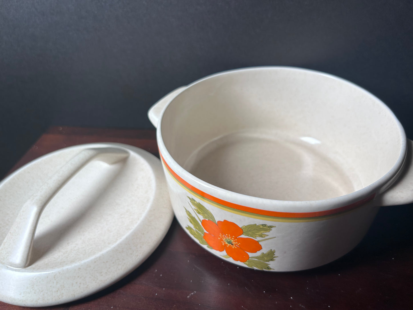 Orange temperware serving bowl with lid