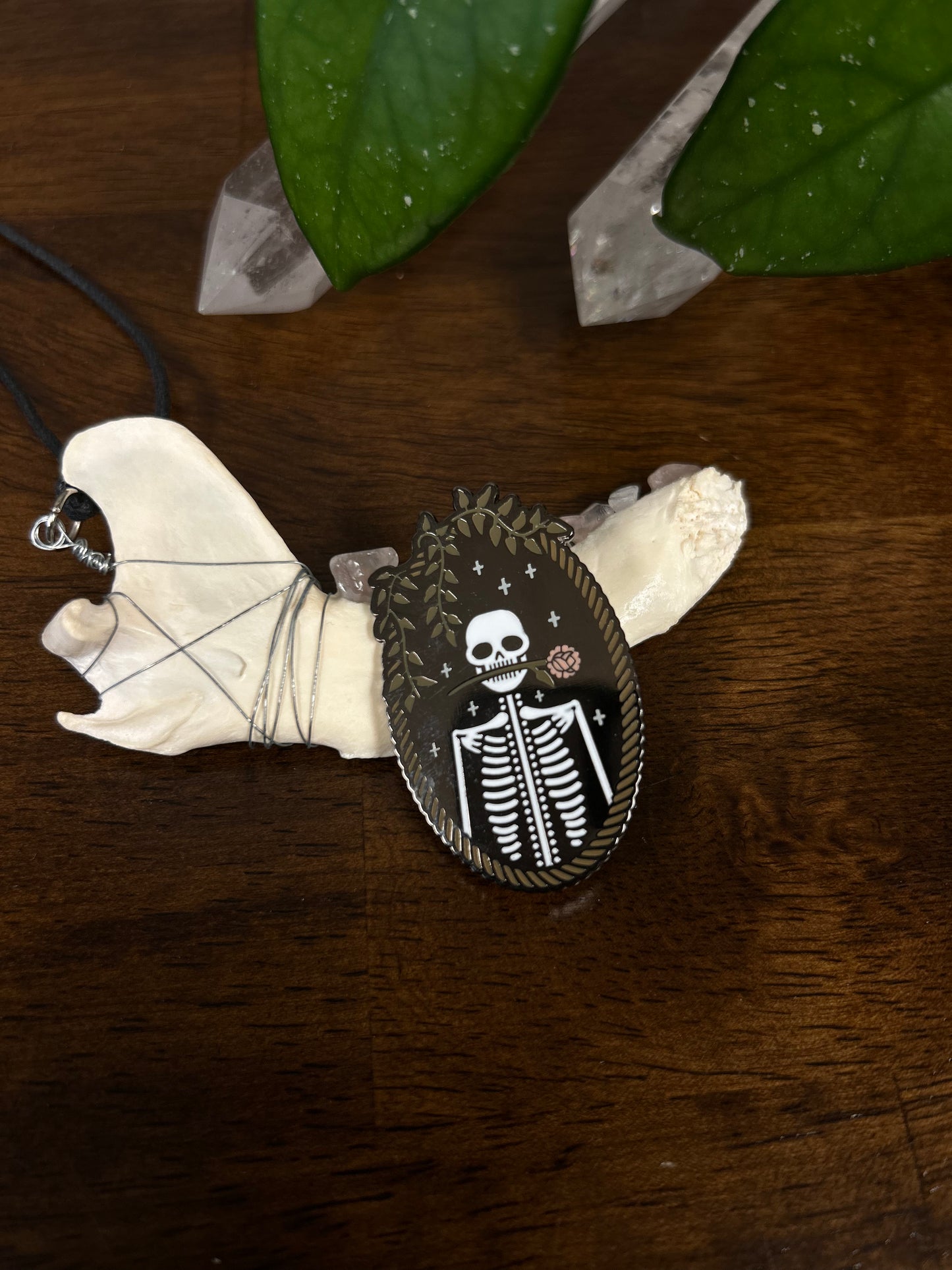 Rose biting skeleton pin