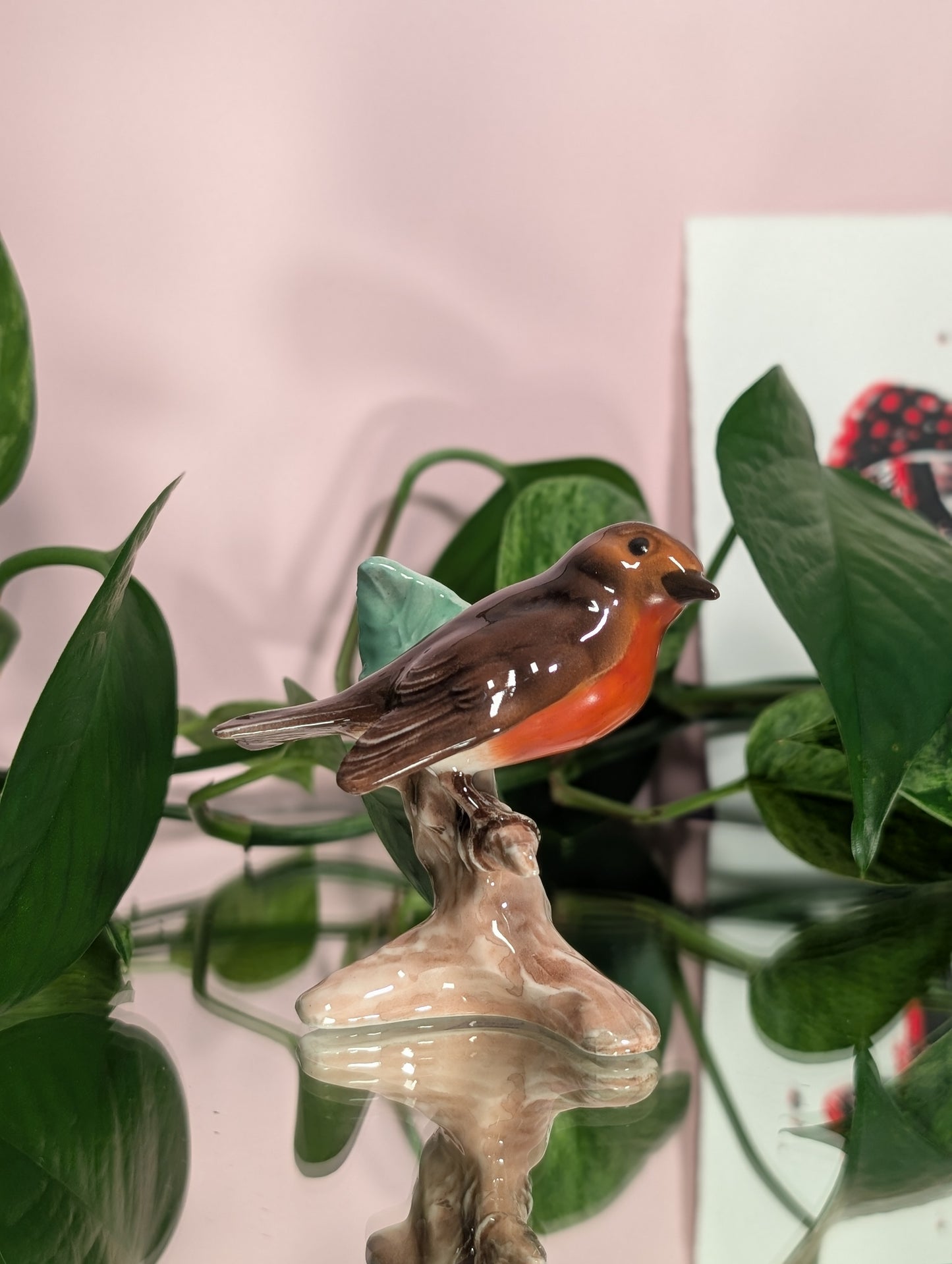 Bird on a branch figurine