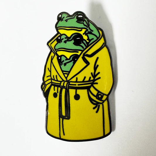Three frogs in a trenchcoat enamel pin